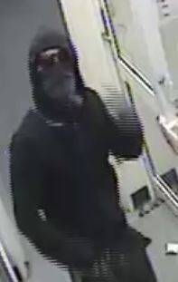 CCTV footage of the man who robbed the Spence 7 Eleven store. Photo: Supplied