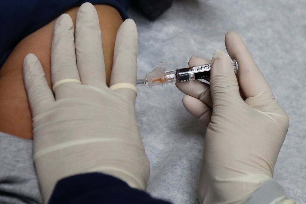 Queensland has a target vaccination rate of 85 per cent for HPV, diphtheria-tetanus-pertussis, and meningococcal vaccines. Photo: AP