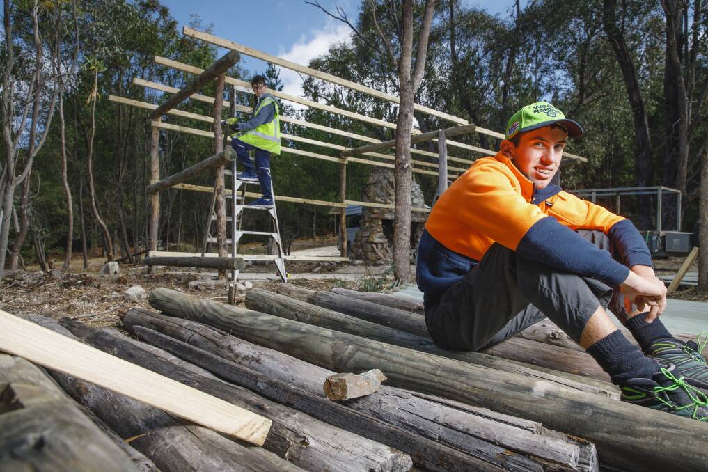 Volunteers Jacques Slater-McCabe, 12, and Cooper Temple-Clarke, 15, are taking time out of their school holidays to help restore Tidbinbilla Hut. Photo: Sitthixay Ditthavong