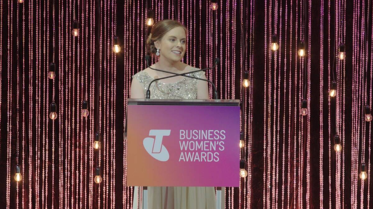 Elise Apolloni, pharmacist and partner at Capital Chemist Wanniassa, receiving her award as the national winner of the Telstra Young Business Woman of the Year in Melbourne on Tuesday night. Photo: Supplied