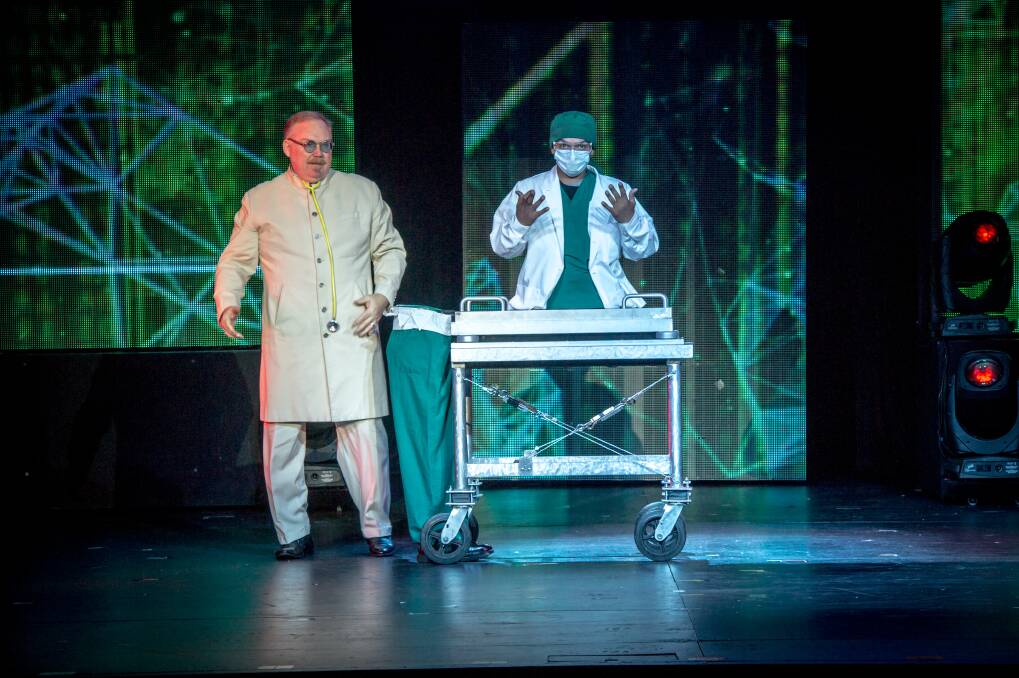 The Inventor (Kevin James), left,  performs some surgery in <i>The Illusionists: Direct from Broadway</i>. Photo: Karleen Minney