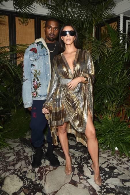 Kim Kardashian in Balmain, with Kanye West, in Paris.  Photo: Getty Images