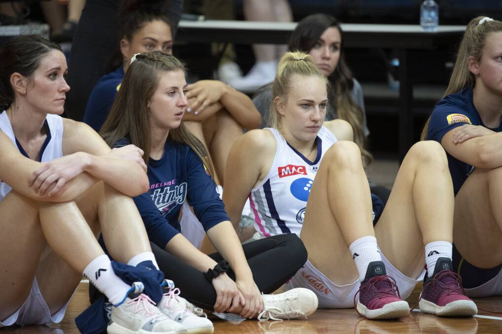 Dejected Adelaide Lightning players after losing the third WNBL grand final to the Canberra Capitals. Photo: Sitthixay Ditthavong
