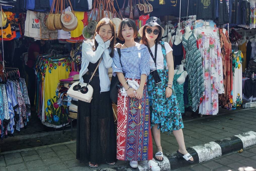 Chen Lizhu with her friends at Tanah Lot Temple in Bali. Photo: Amilia Rosa