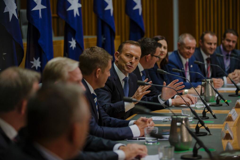 Prime Minister Tony Abbott with state and territory leaders at a COAG press conference in Canberra last week. Photo: Jamila Toderas