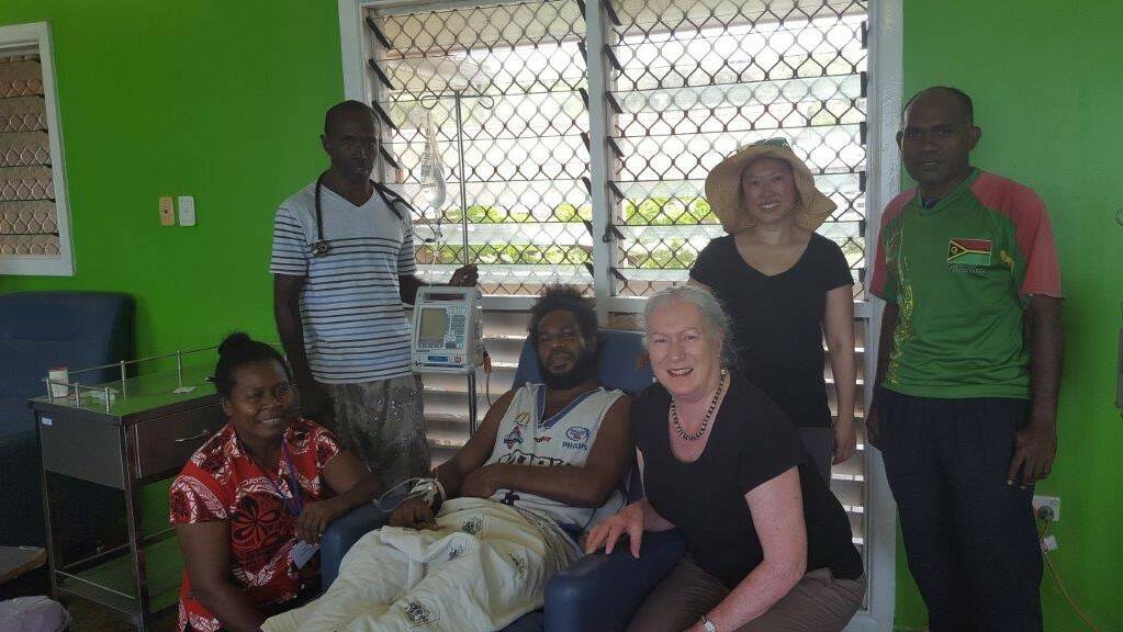 The team treating the 34-year-old patient at the hospital in Honiara, Solomon Islands. From left: nurse Meltus, Dr Andrew Soma, the patient, Wendy Spencer, Beth Hua and nurse Stephen. Photo: Supplied