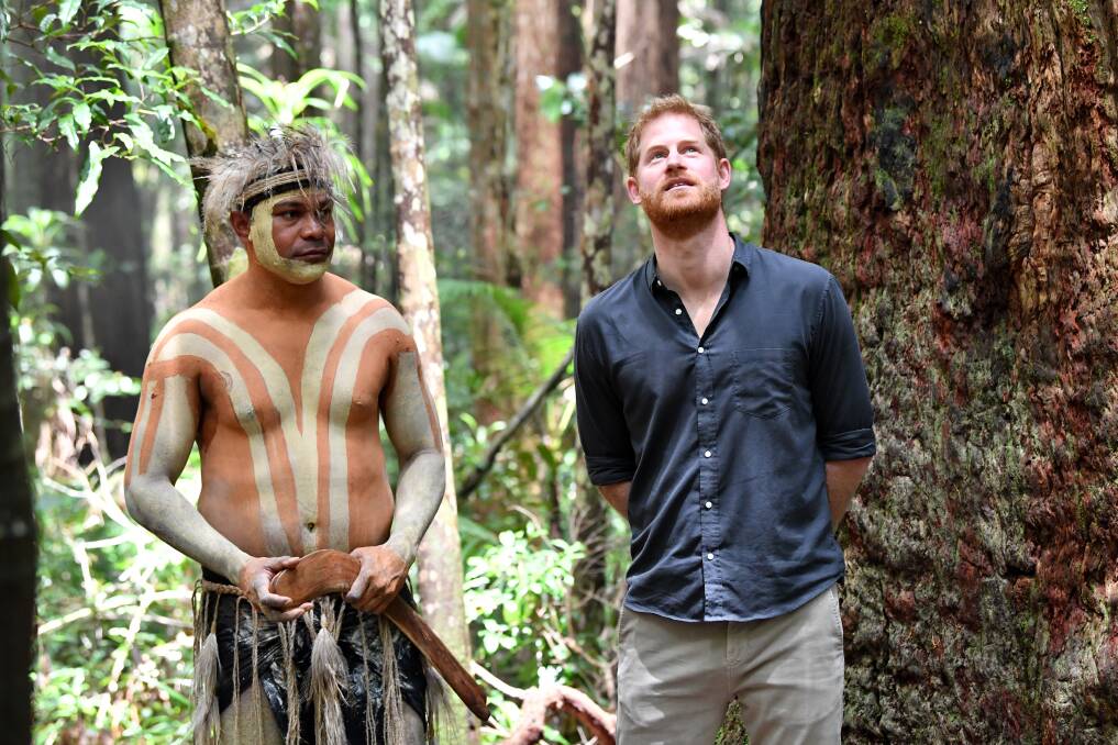 Britain's Prince Harry (right), the Duke of Sussex, is seen with Fred Bulanyu Leone at Pile Valley on Fraser Island in October 2018. Photo: AAP