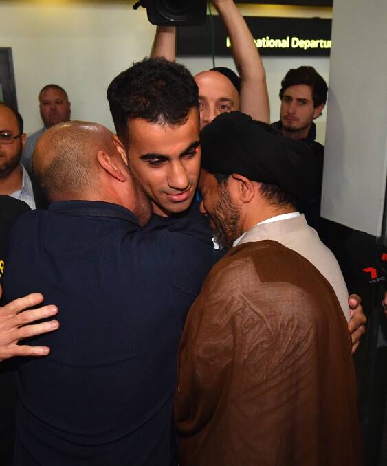 Hakeem al-Araibi is greeted by friends and supporters as he arrives in Melbourne. Photo: Joe Armao