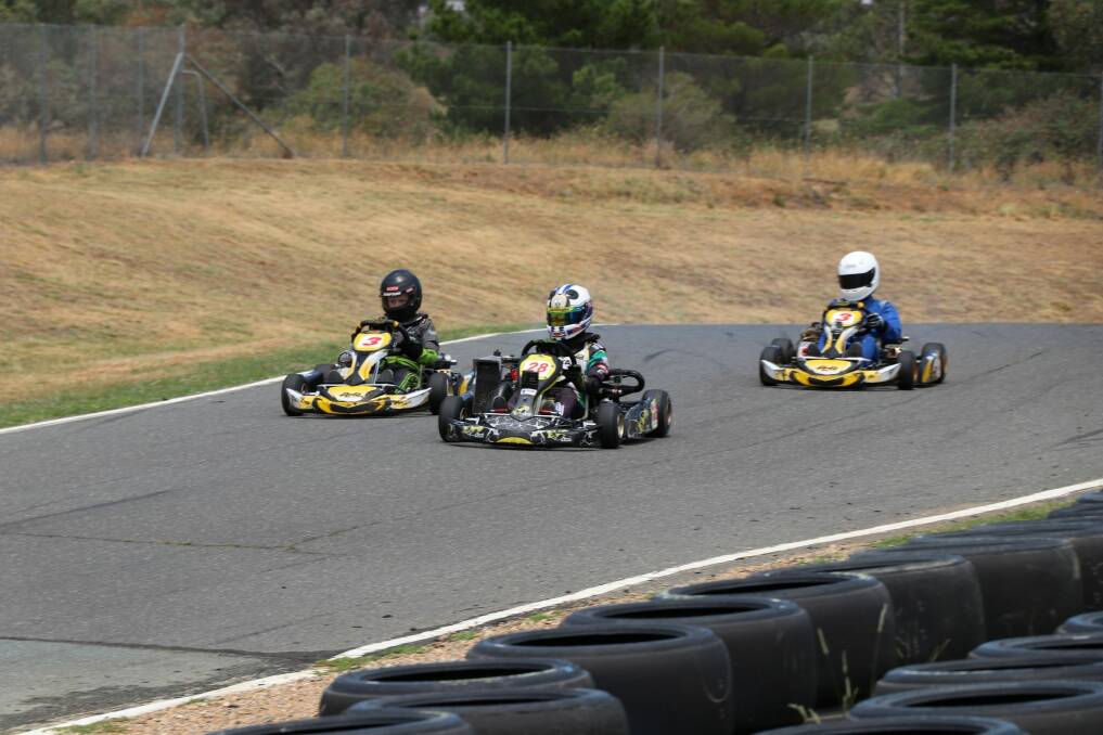 Kart racers using Circuit Mark Webber on Wednesday. Minister Mick Gentleman discussing the plans with members of the Canberra Kart Racing Club. Photo: supplied