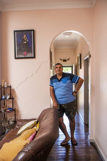 Umberto Galasso at his damaged home in North Strathfield. Photo: Louise Kennerley