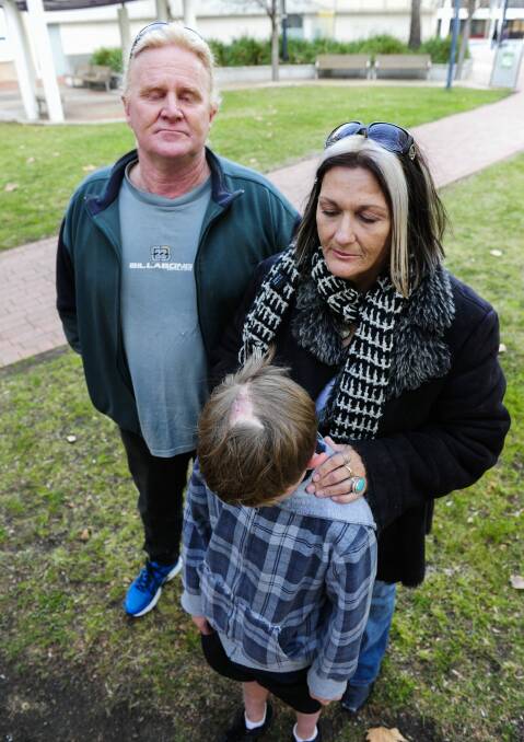 Patrick Hartigan and Joanne Mangan with their son Jack Hartigan, who filed a civil action against the ACT government after he was mauled by dogs at an Housing ACT property. Photo: Melissa Adams MLA
