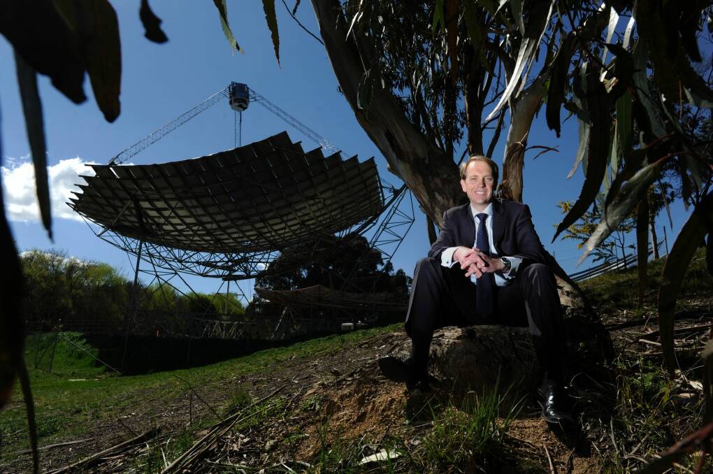 Simon Corbell, pictured at the ANU's solar concentrator dish, has rejected claims the Coalition's energy policy is technology neutral.  Photo: Lannon Harley 
