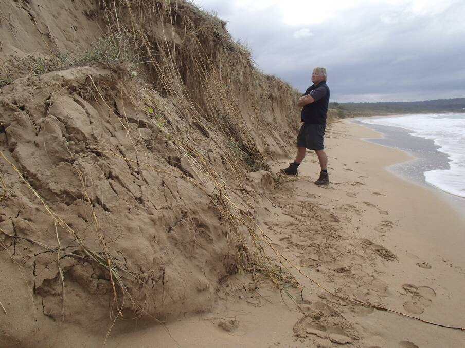 South Coast conservationist John Perkins inspects erosion at South Durras. Photo:  
