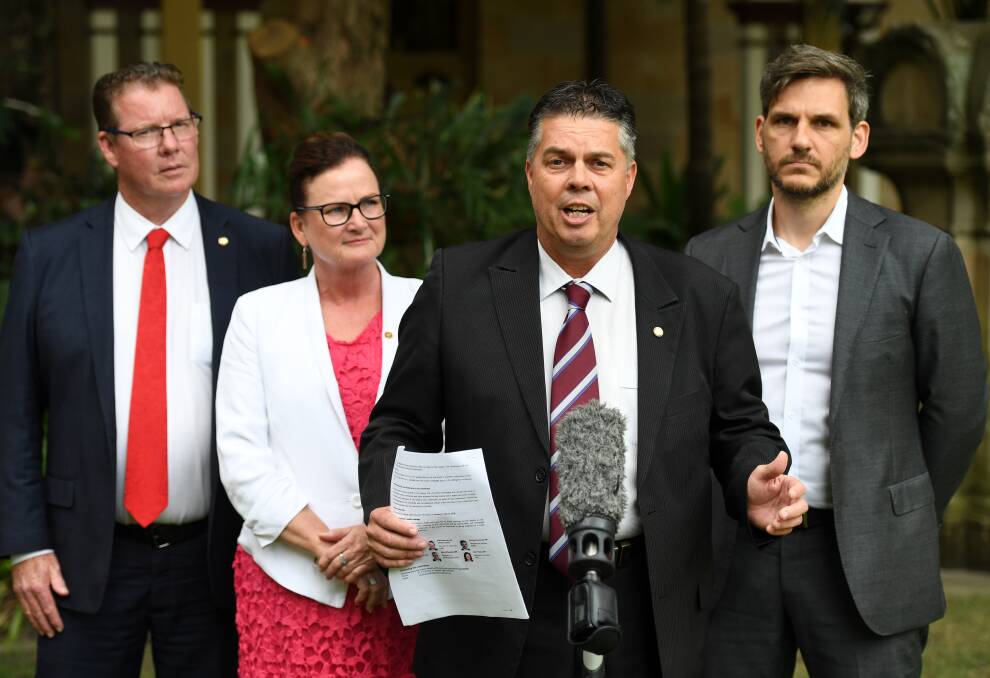 (From left) the Queensland Government Health Committee's Barry O'Rourke, Joan Pease, Aaron Harper, and Michael Berkman at a press conference at Parliament House in Brisbane on Thursday. Photo: AAP