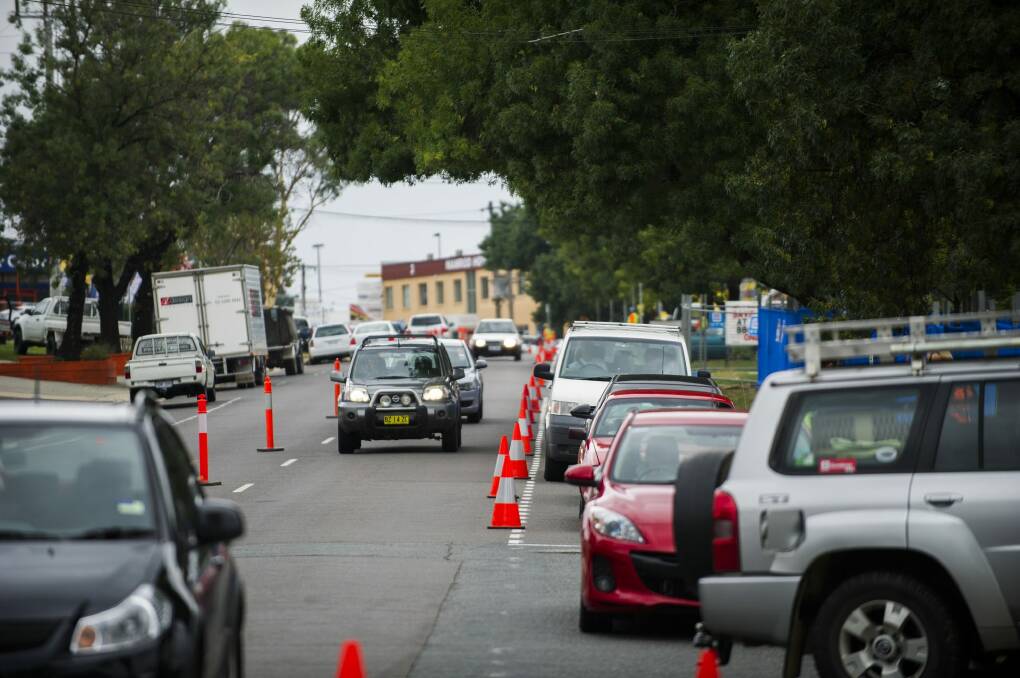 Traffic about 11am ahead of free petrol as part of a two-hour promotion at Metro petrol station in Fyshwick last Wednesday.


 Photo: Rohan Thomson