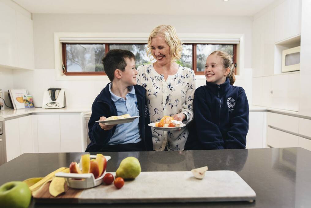 Terree Olive with her two children, Lucas and Emily, and their healthy afternoon tea after school at home in Franklin. Photo: Rohan Thomson