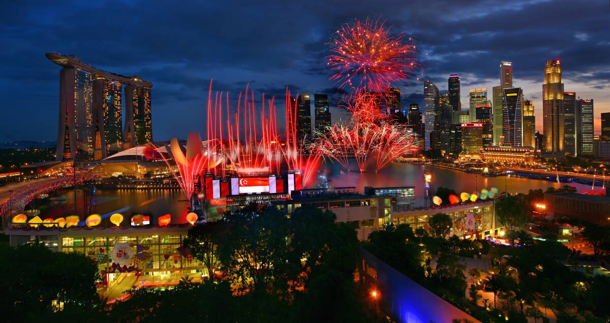 Fireworks are launched from a floating platform during Singapore's National Day Parade. Photo: Singapore Tourism Board