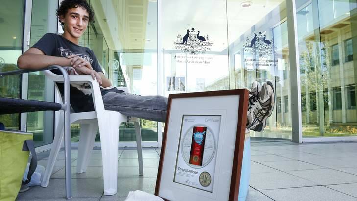 WAITING GAME: Harley Russo, 13, in line at the Royal Australian Mint in Deakin. Photo: Jeffrey Chan