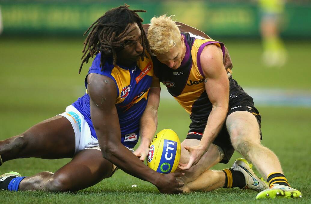 Eagles ruckman Nic Naitanui and Steven Morris of the Tigers compete for the ball on Friday. Photo: Getty Images
