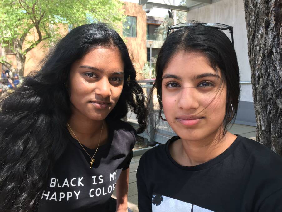 Students Sinali Hapu Arachchige, left, and Apoorva Sajja of Narrabundah College, who have different views from their mothers. Photo: Steve Evans.