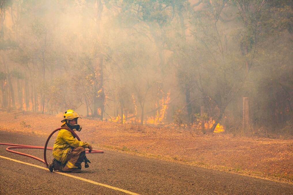 Local firefighters are fatigued and suffering from heat stress, but interstate reinforcements have eased the workload. Photo: QFES Media