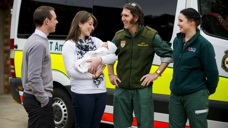 Chris and Meryn Weenink, baby Emma,  Intensive Care Paramedic Gavin Godkin and second-year paramedicine student Erin Gilliland, outside the Weenink's home in Florey where Emma was born two weeks ago. Photo: Rohan Thomson