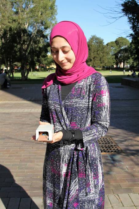 Sara Khalifa with the first gait-authentication prototype in hand.  Photo: CSIRO