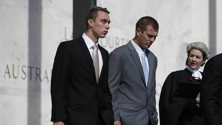 Former ADFA cadets Dylan Deblaquiere, left, and Daniel McDonald, centre, leave the ACT Supreme Court earlier this month. Photo: Jeffrey Chan
