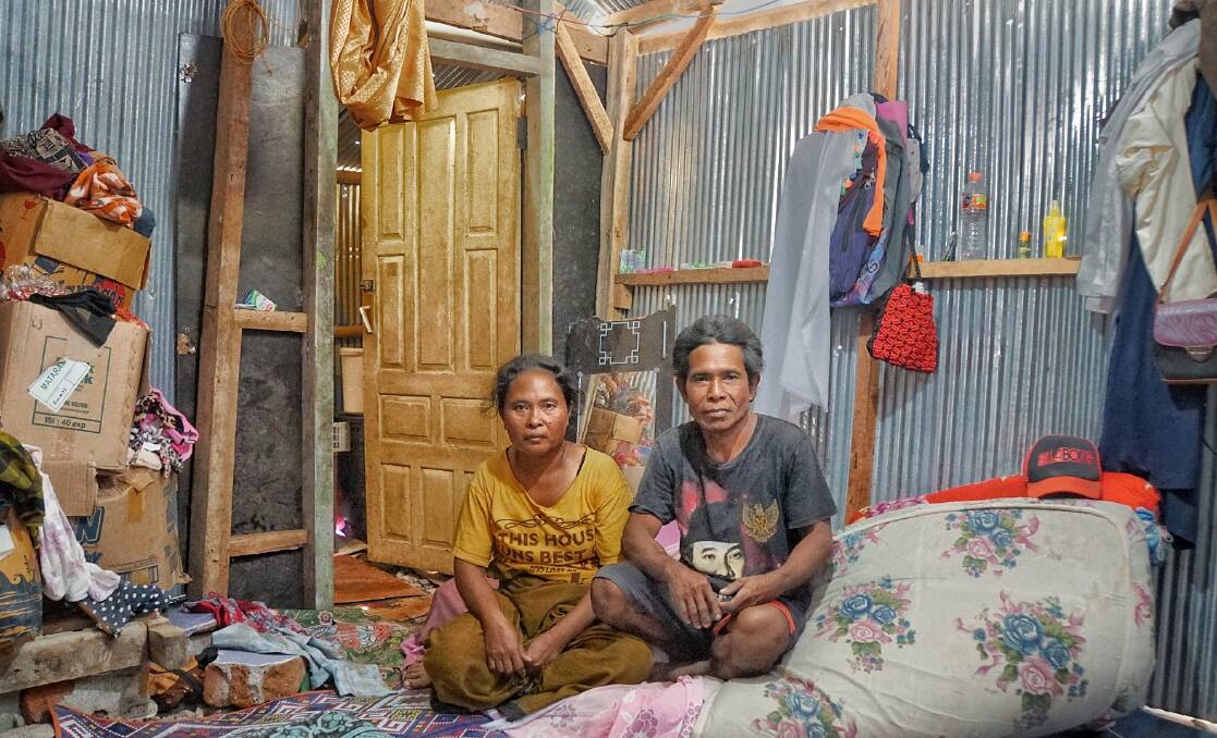 Lombok refugees Ismail, right, and his wife  Suhaini  in their temporary home. Photo: Amilia Rosa