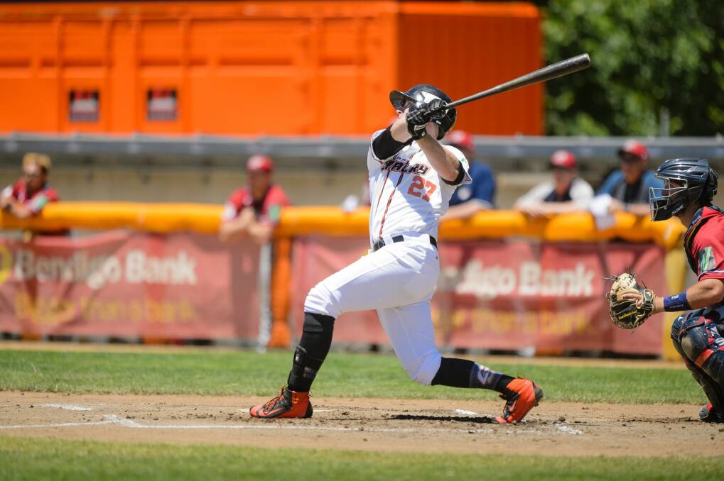 Canberra outfielder David Kandilas hits a two-run homer off Melbourne starter Jon Kennedy in the first inning.  Photo: Sitthixay Ditthavong