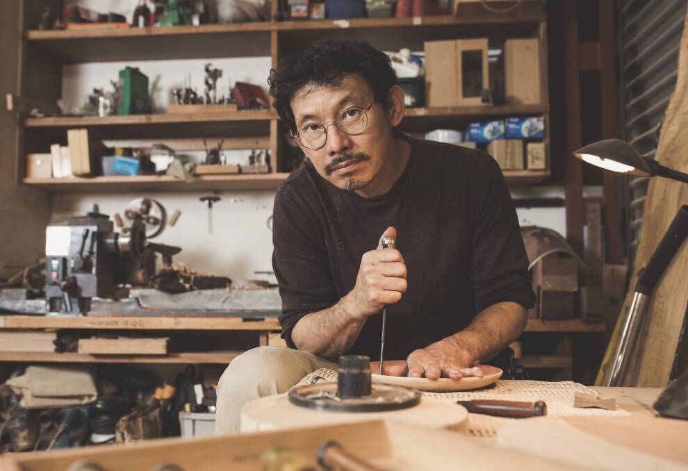 Hiroshi Yamaguchi, founder of KOITOYA designs, uses Canberra street trees and Japanese sustainable hardwood in many of his pieces. Photo: Jamila Toderas