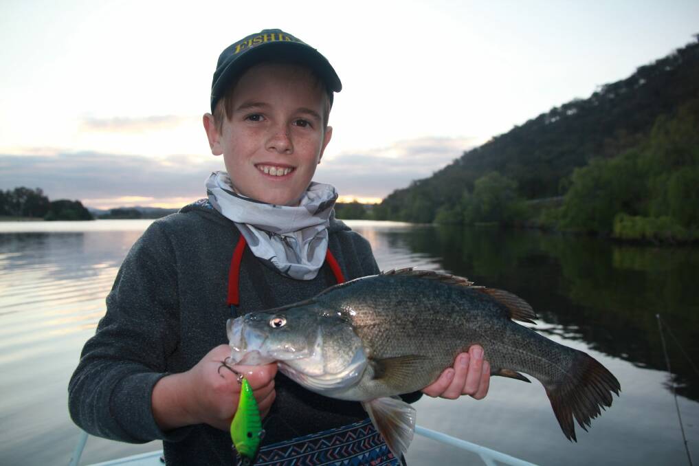 There’s terrific fishing on offer right in the heart of Canberra. Ryan Richards with a nice Lake Burley Griffin golden perch Photo: Ross Caddaye