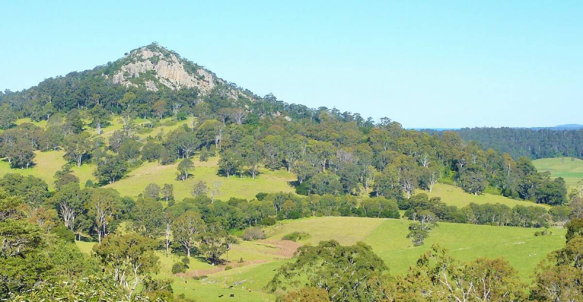 Najanuga (Little Dromedary), a striking rocky outcrop viewed from the lookout in Central Tilba. Photo: Tim the Yowie Man