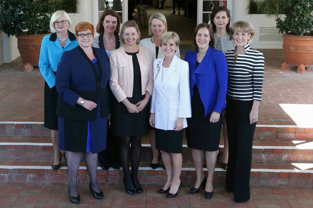 No need for Mr Turnbull to make up the numbers: The women in his new ministry in a group picture on the steps of Government House. Photo: Alex Ellinghausen