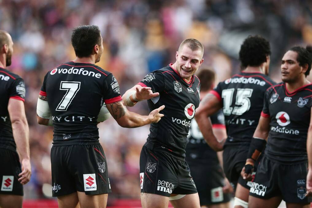Local hero: Foran celebrates with teammates after scoring a try. Photo: Getty Images