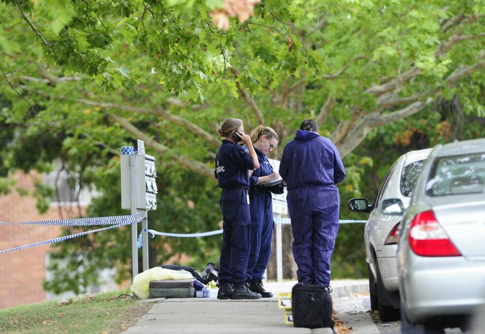 Police investigating the suspicious death at the Stuart Flats in Griffith on Monday. Photo: Melissa Adams 