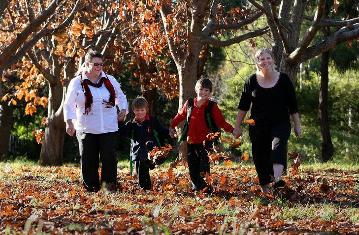 Heart Attack survivor Carol Jones with grandsons Keanan Patron, 5, Samuel Patron, 8, and daughter Elizabeth Patron walk together after school. Photo: Jeffrey Chan