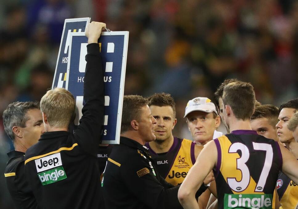Tigers coach Damien Hardwick speaks to his players during a break. Photo: Getty Images