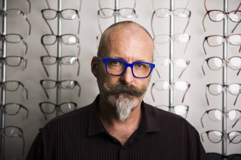 Managing director of Curtain Optical, Corey Nicholls, has to rely on business from repeat customers because he no longer gets passers-by. Photo: Dion Georgopoulos