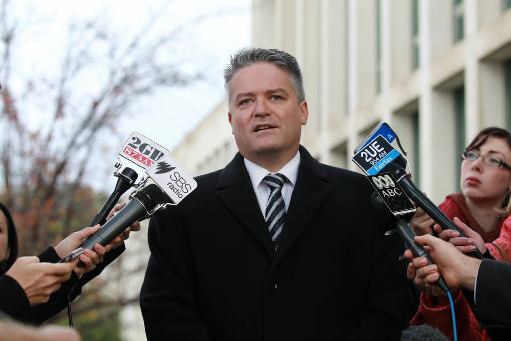 Finance Minister Mathias Cormann says the way public service workers' compensation may be reconsidered. Photo: Alex Ellinghausen