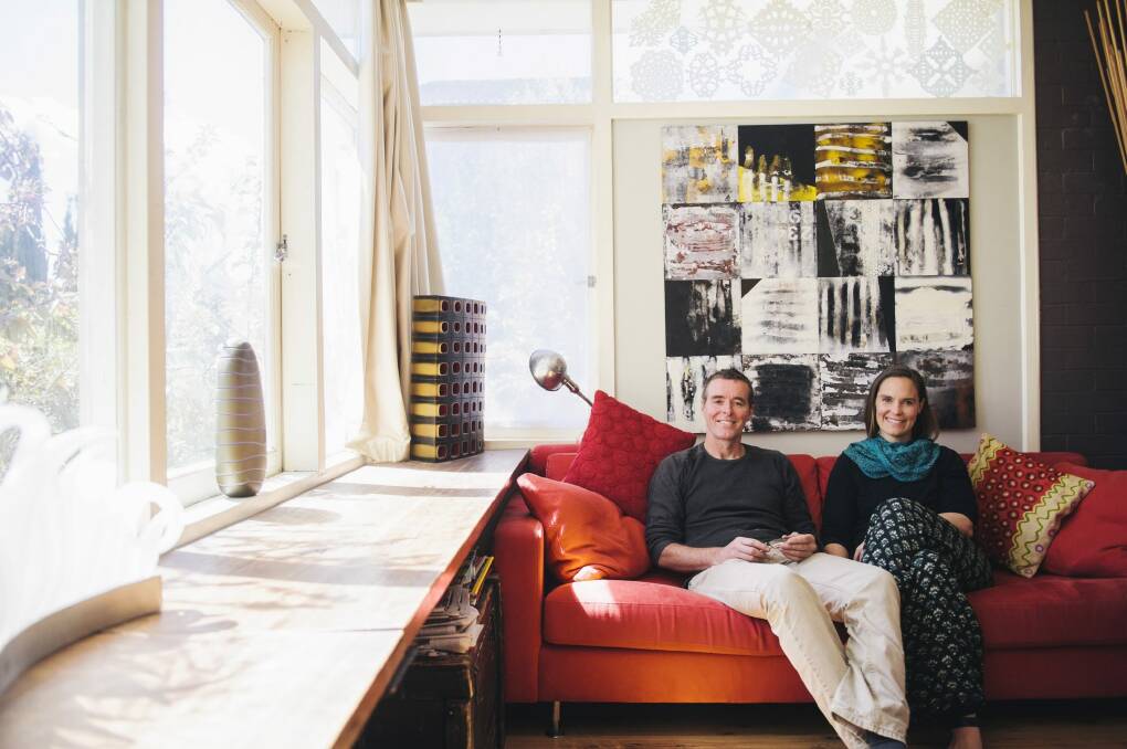 Home sweet home: There is large painting by Queanbeyan artist Claire Primrose behind the sofa. Curtis double-glazed the windows. 
 Photo: Rohan Thomson
