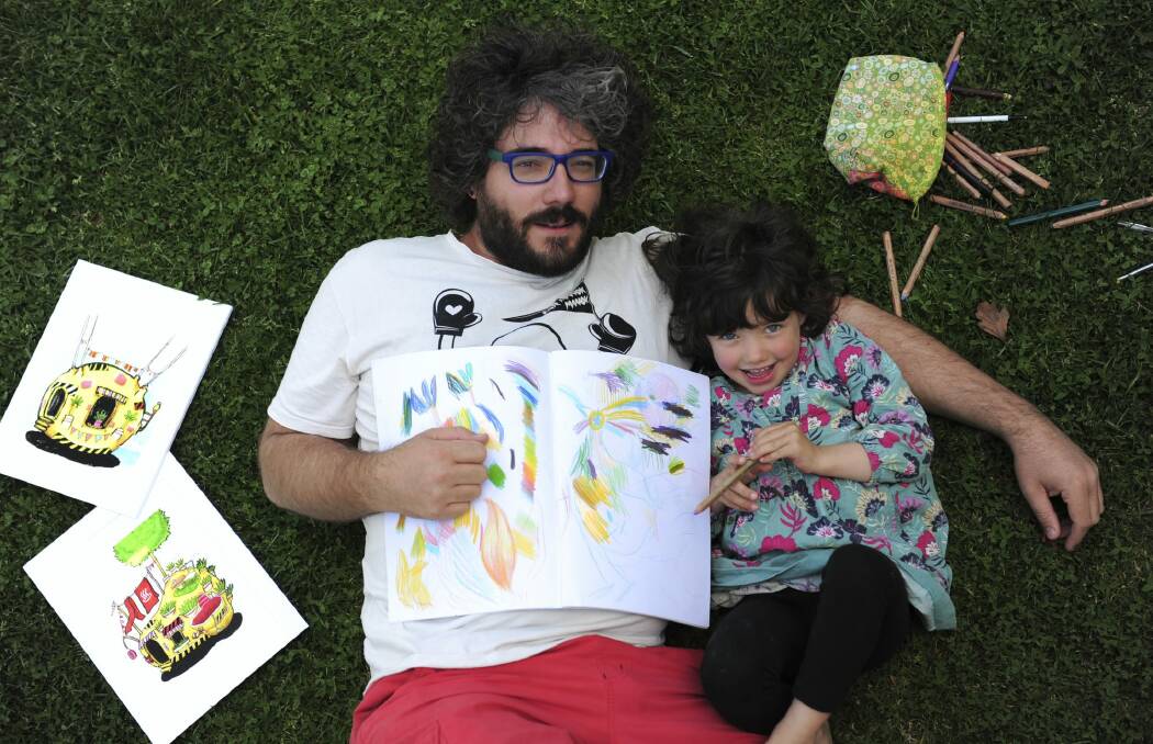 Artist Paul Summerfield and daughter Sumi Zemita, 4, with some examples of the work in his new colouring book. Photo: Graham Tidy
