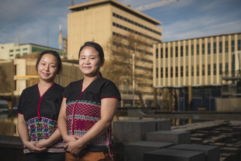 After being terrorised by the Burmese army in their native Karen State, sisters Rebecca Di Gay and Lah Gay Paw are building new lives in Canberra. Photo: Sitthixay Ditthavong