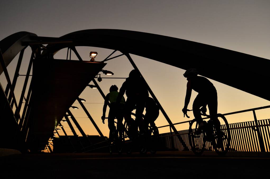 Early morning ride over the the Goodwill Bridge. Photo: AAP
