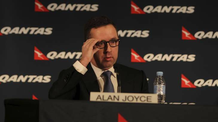 Alan Joyce describes the cuts as "tough decisions" during the press conference. Photo: Tamara Dean