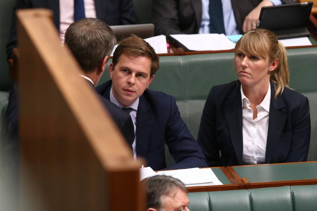 Opposition Leader Bill Shorten consults advisers Ryan Liddell and Kimberley Gardiner during question time last year.  Photo: Andrew Meares