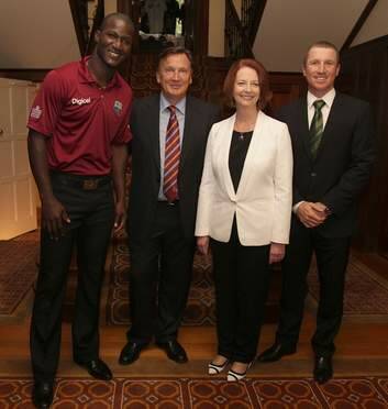 Prime Minister Julia Gillard and her partner Tim Mathieson with West Indies captain Darren Sammy and PM's XI vice-captain Brad Haddin. Photo: Alex Ellinghausen