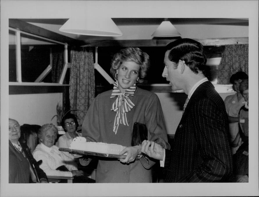 Prince Charles and Diana in London. The Princess was given a cake and joked with Prince Charles as she asked, "Is there rum in it?". Photo: Syndication International