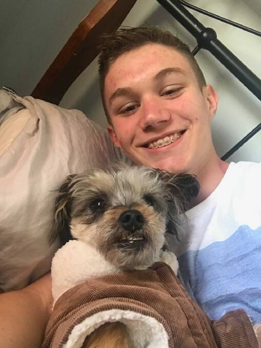 Adriaan Roodt, who died after an incident at Mount Ainslie on Thursday, and one of his dogs, Muffin. Photo: Supplied