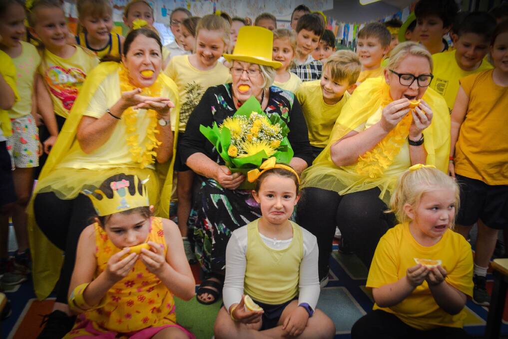 Not the best taste... Jerrabomberra Public School teachers Jane Taylor and Peta Kenningham with principal Chris Hunter (in hat) try the Lemon Face Challenge with students Maggie Coy, Grace Young and Ellie De Landre-Line. Photo: Shell Hanrahan